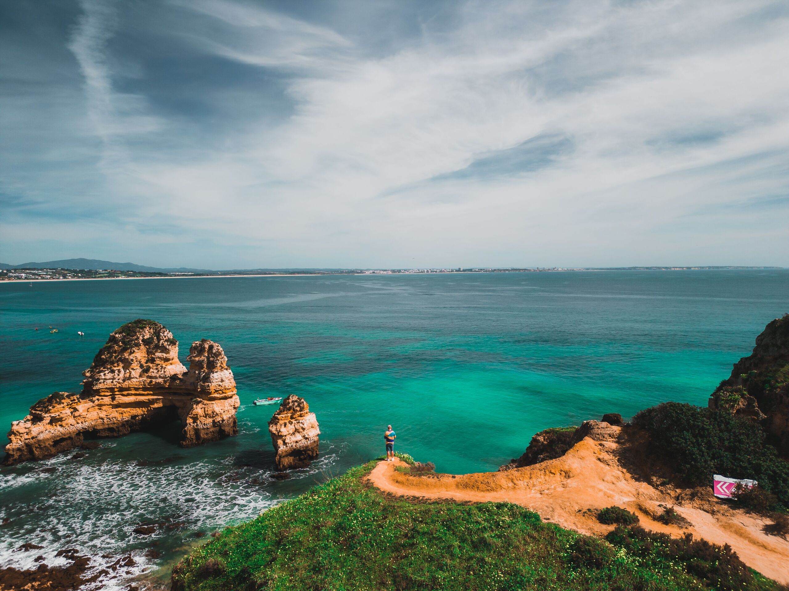 A clifftop viewpoint over the turquoise bay and rock formations near Lagos