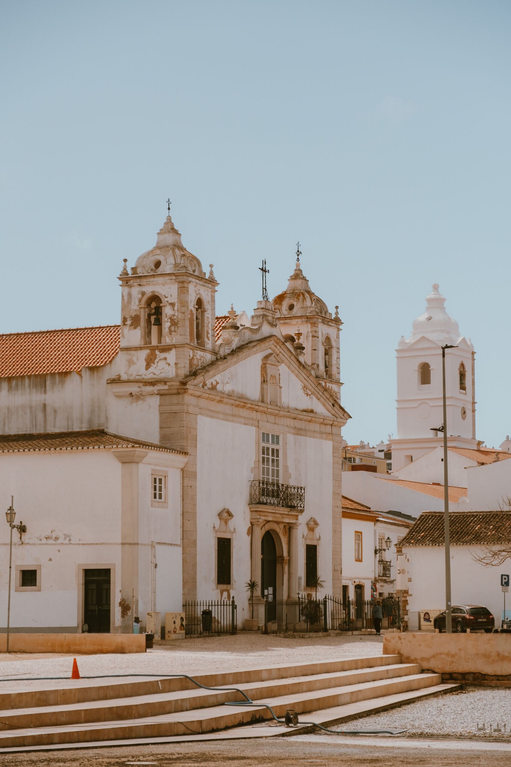 The whitewashed Igreja de Santa Maria on a quiet Lagos square